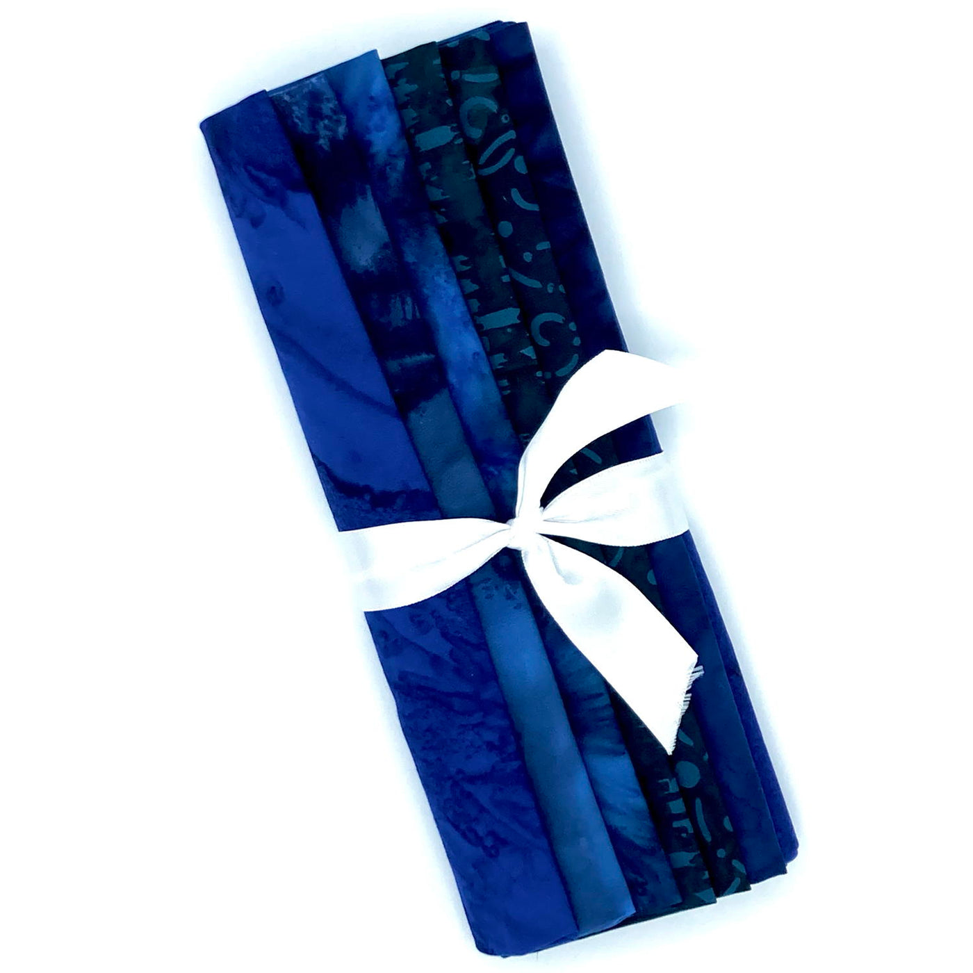 A fabric bundle of six different deep blue fat quarters.