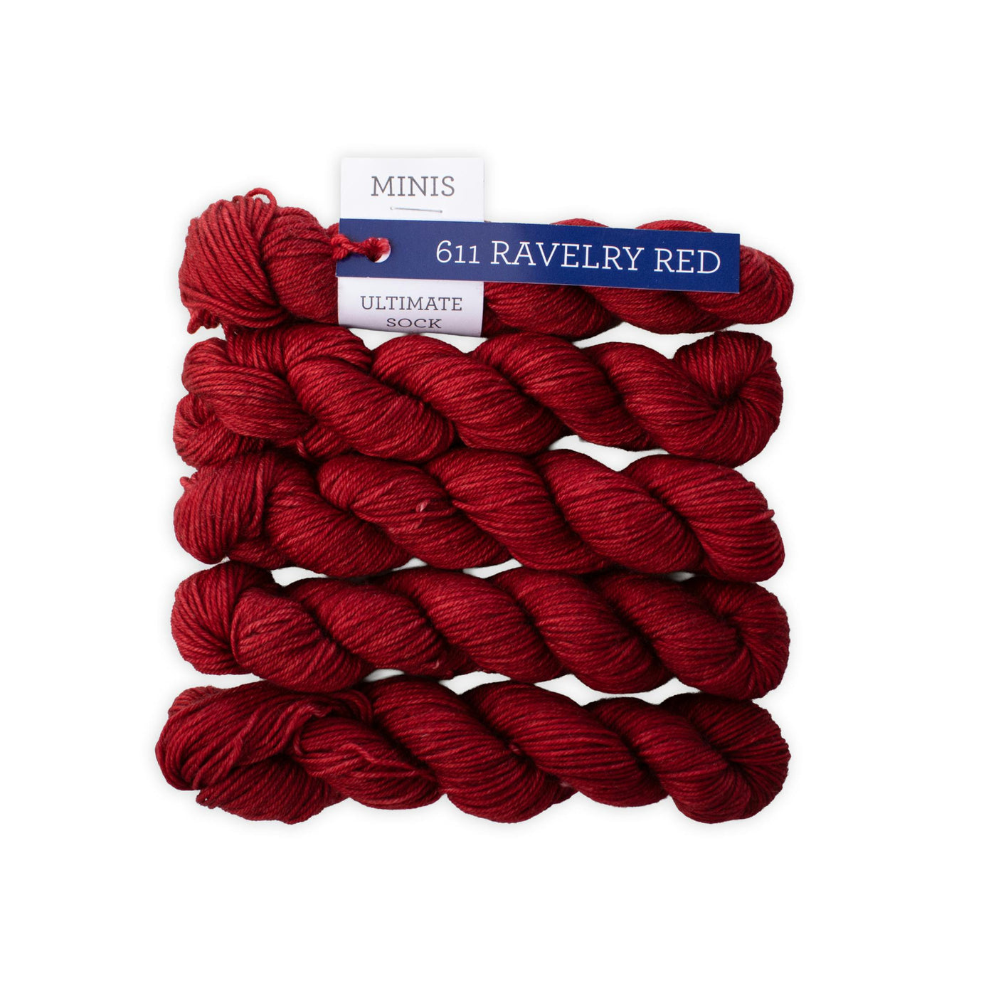 Red yarn skeins with a label on a white background