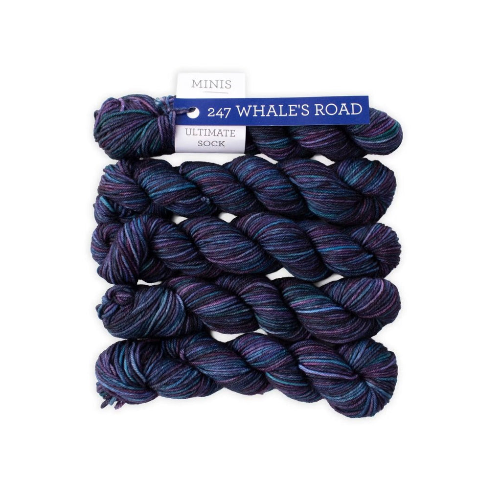 Three skeins of yarn with a label on a white background